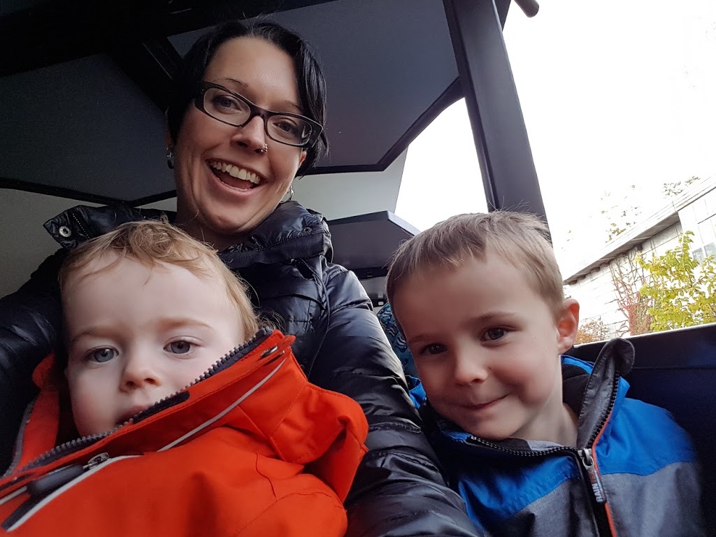 Mom with two boys smiling