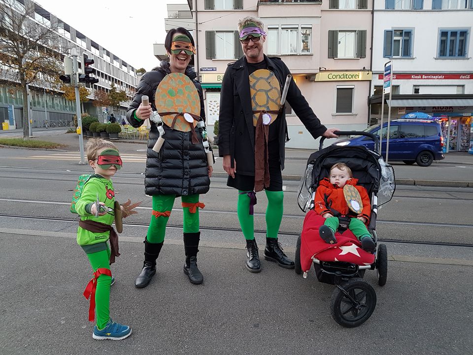 family in turtle masks