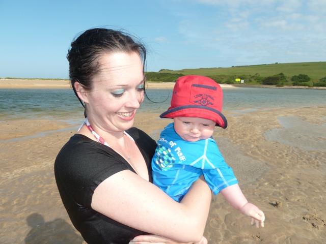 Mom with the baby on a beach