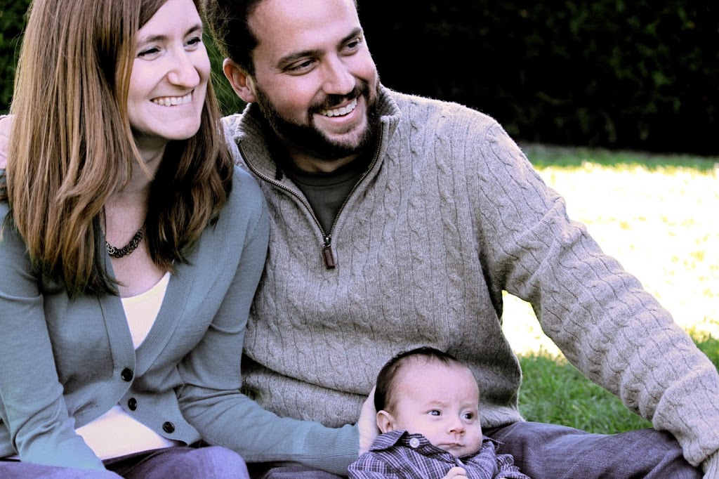 Family on the meadow smiling