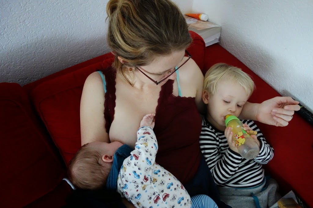 Mom with two boys on the couch